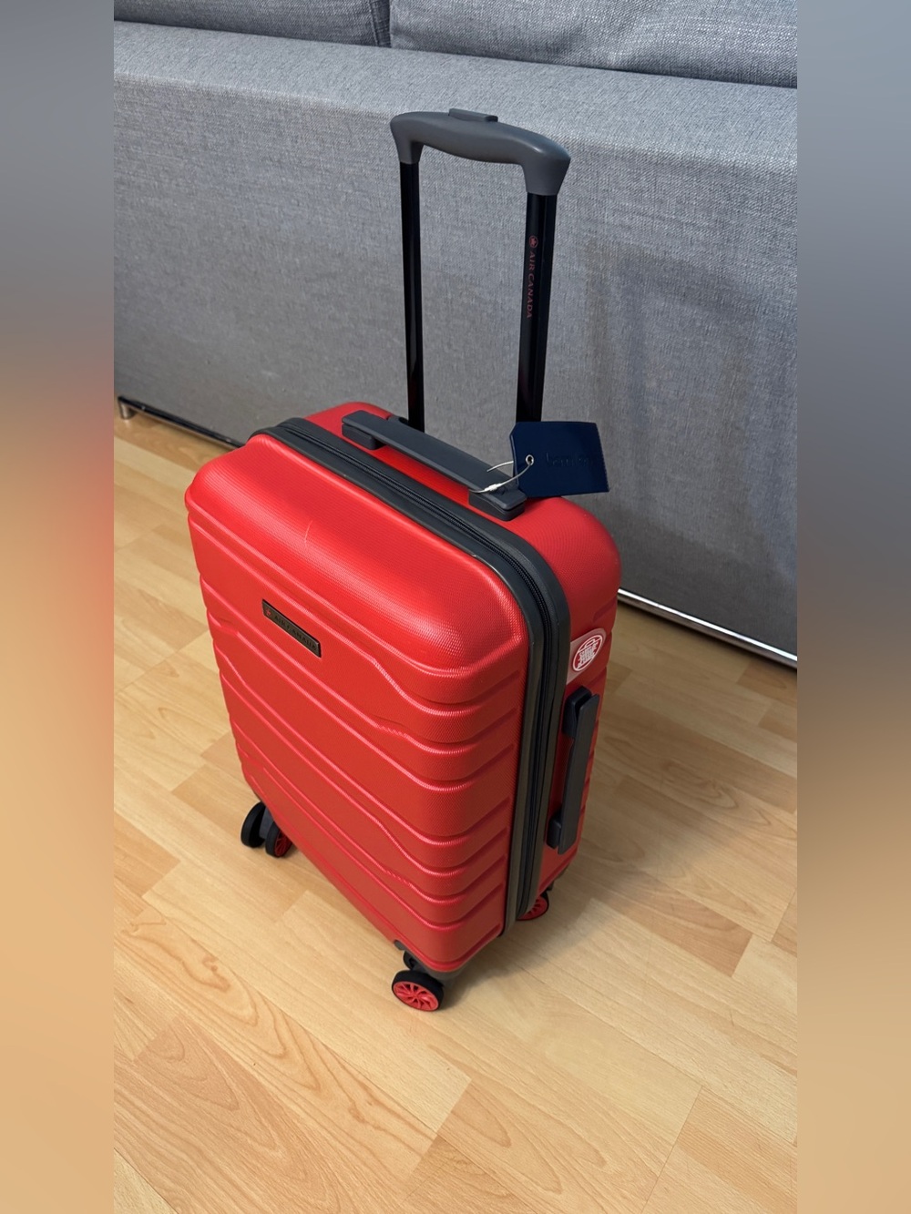 Red Hardshell 21” Standard Carry-On Spinner Luggage